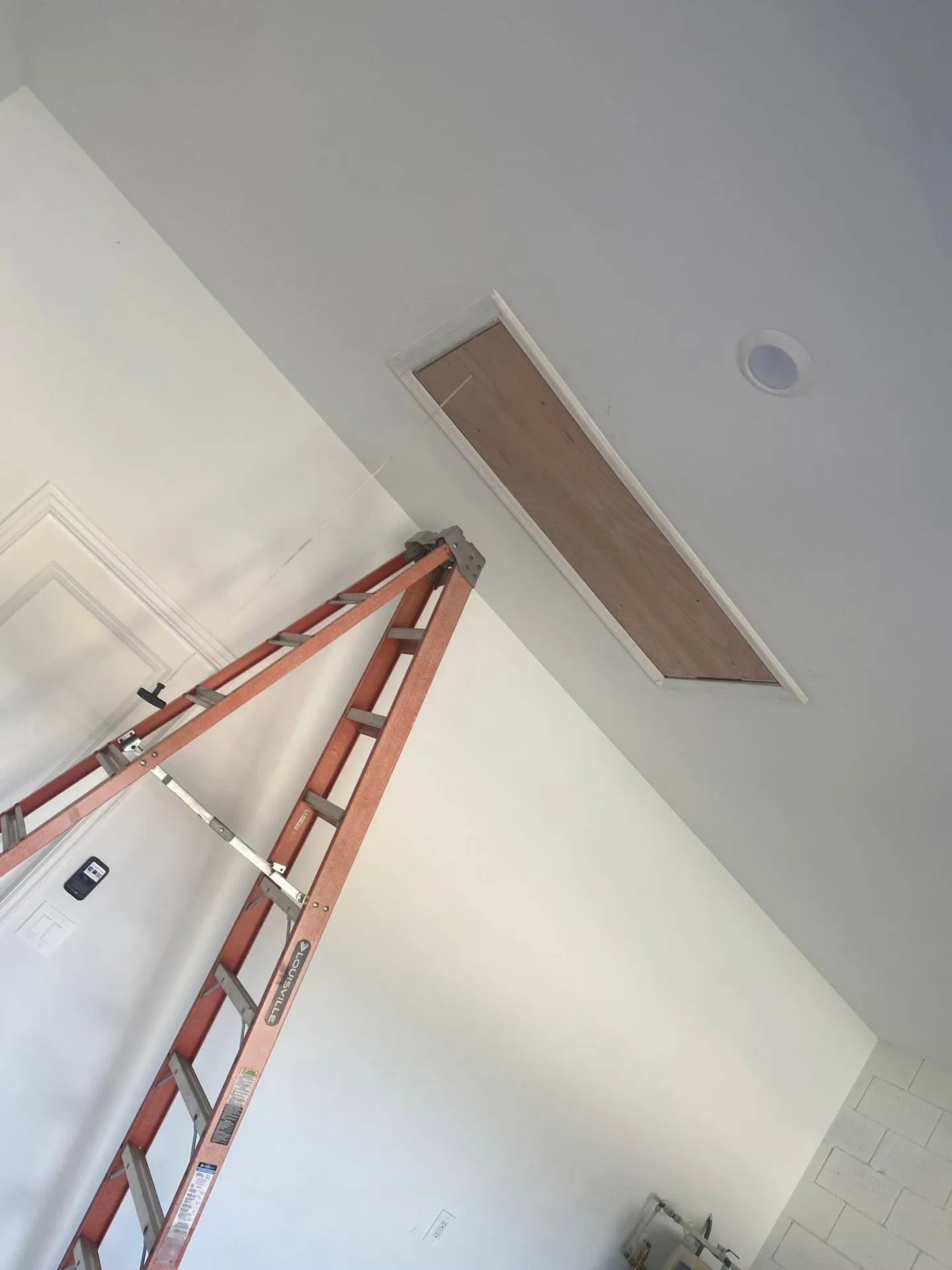 Ceiling opening, panel installation and finished result.