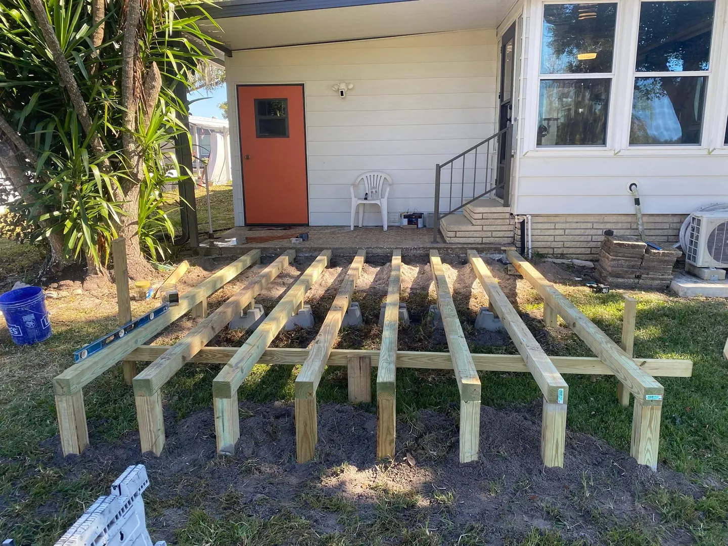 Wood deck during construction and after completion.