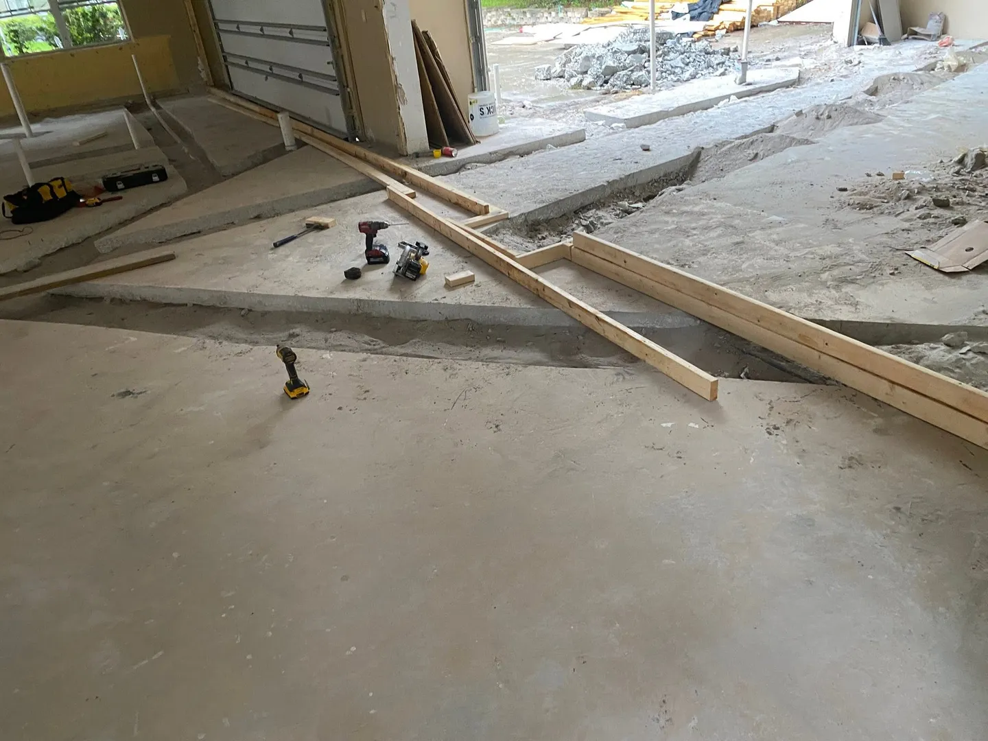 Interior surface during different stages of floor preparation.