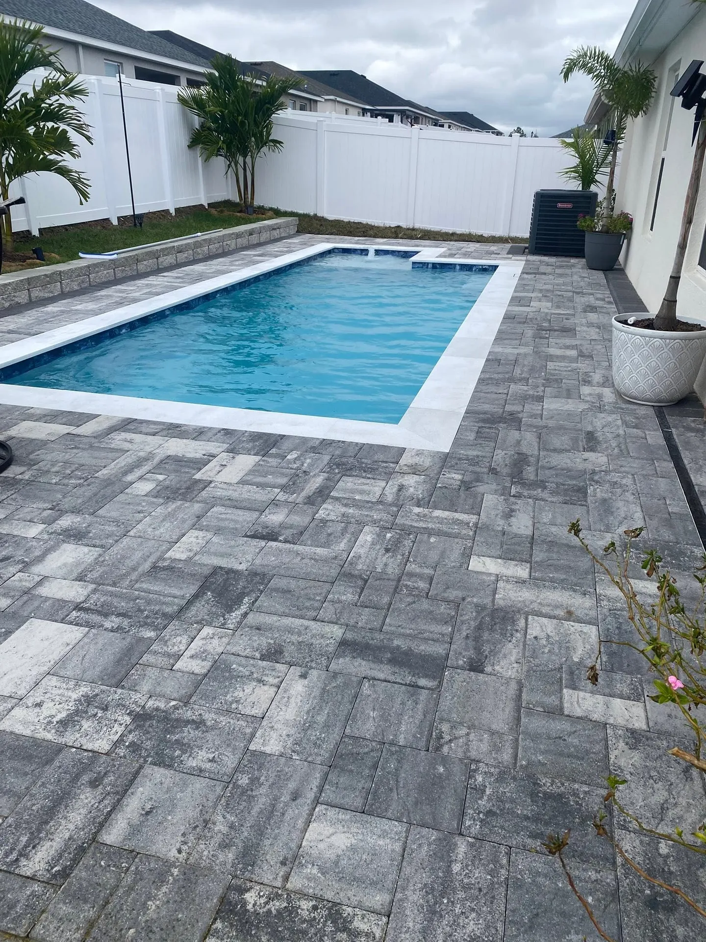 Pool area before, during and after the paver work.
