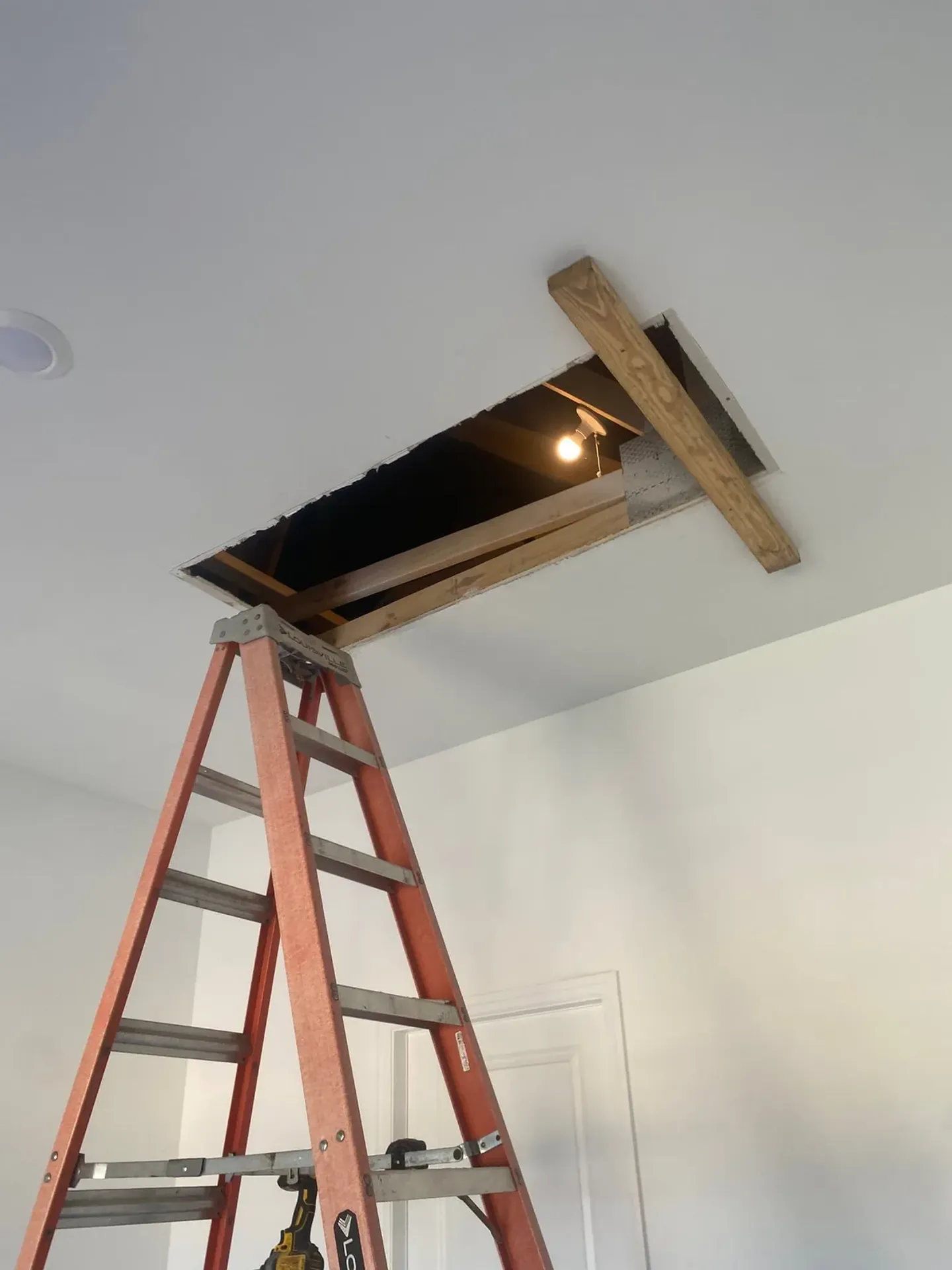 Ceiling opening, panel installation and finished result.