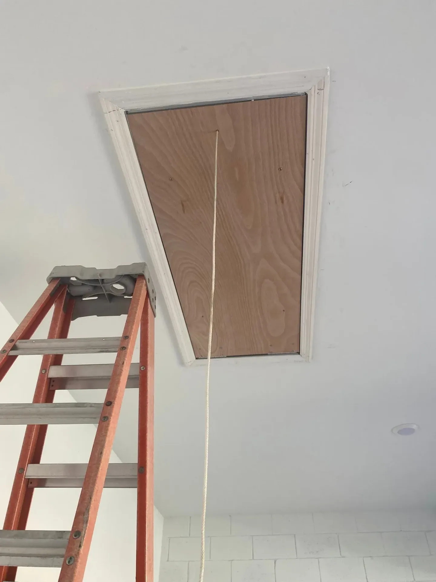 Ceiling opening, panel installation and finished result.
