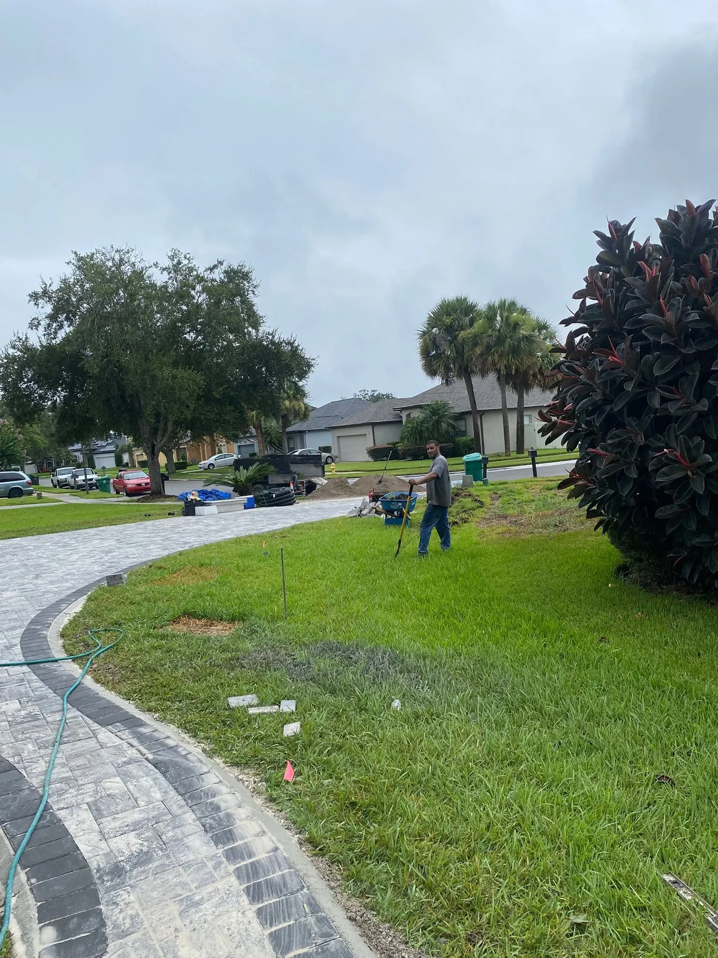 Paver driveway and walkway at different stages of the project.
