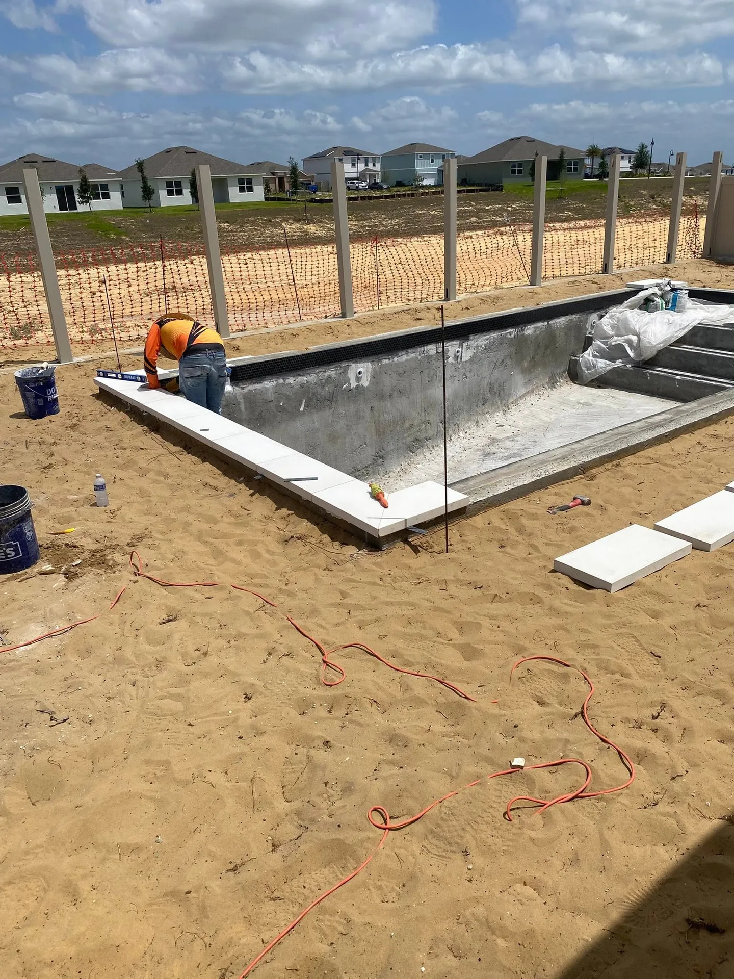 Pool area before, during and after the paver work.