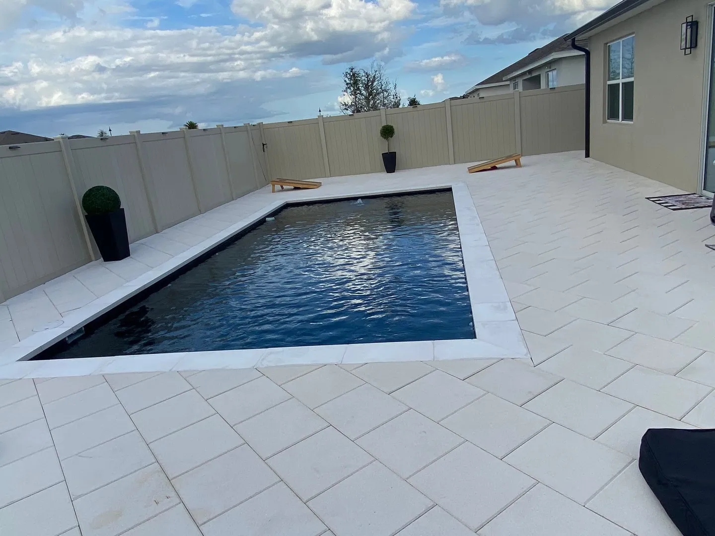 Pool area before, during and after the paver work.