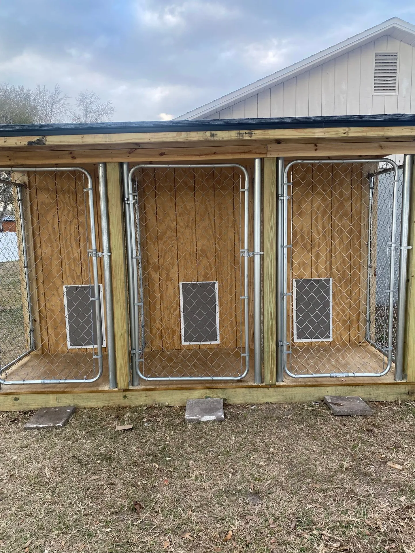 Wood utility shed during construction and after completion.