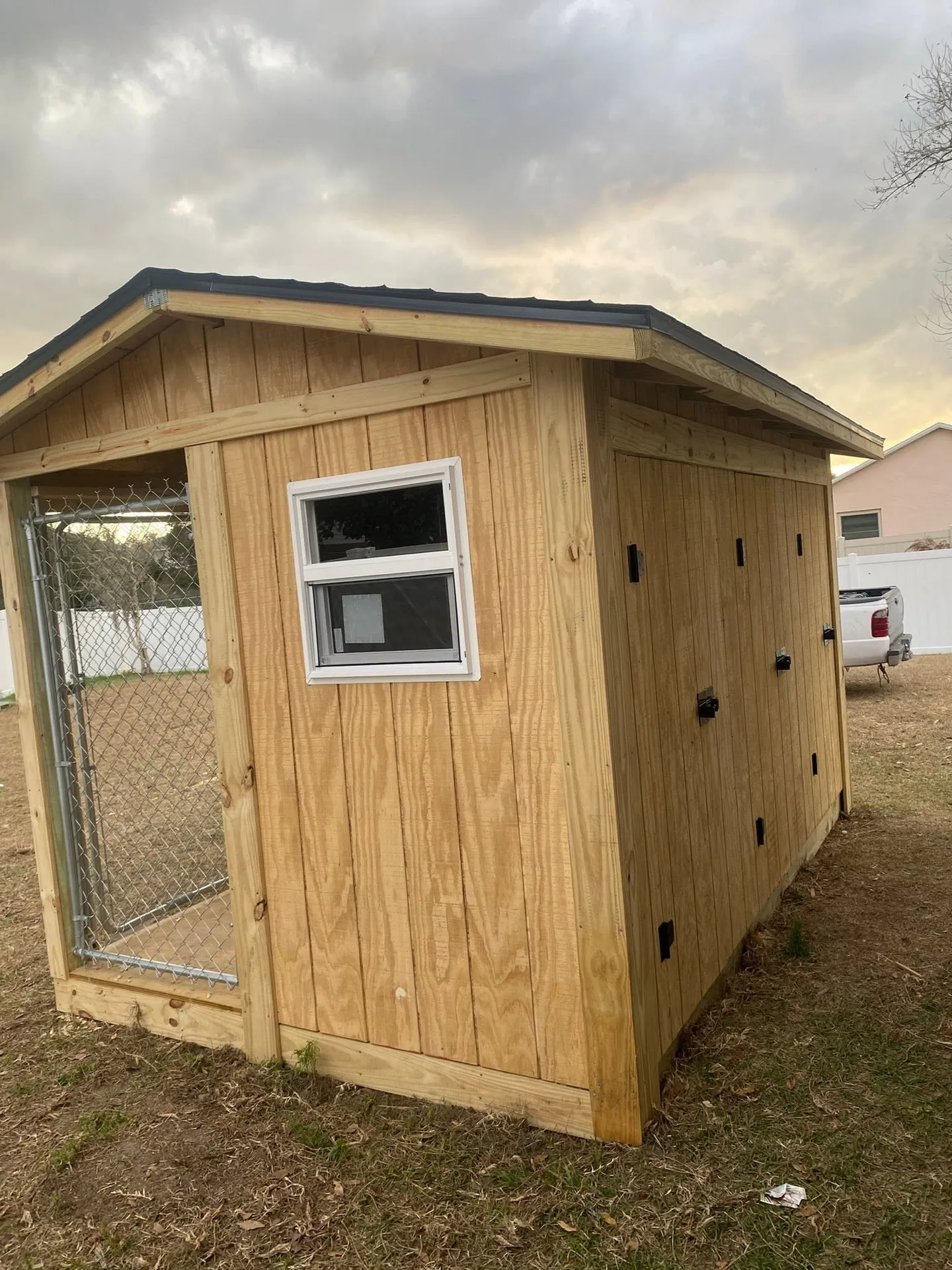 Wood utility shed during construction and after completion.