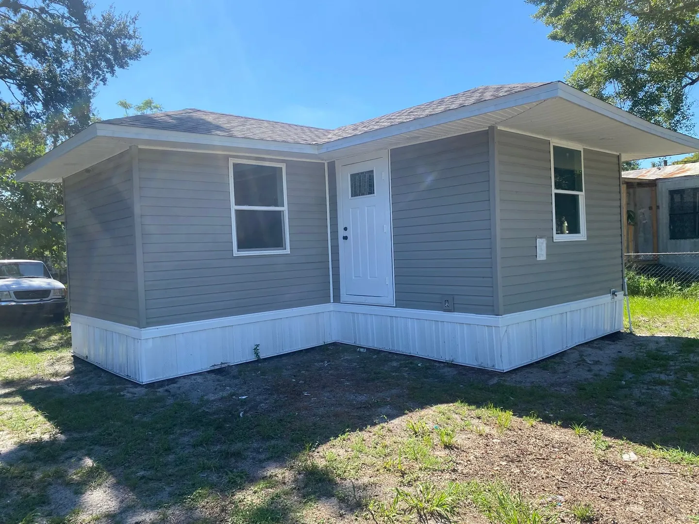 Completed interior, bathroom, door, shelving and exterior improvements.