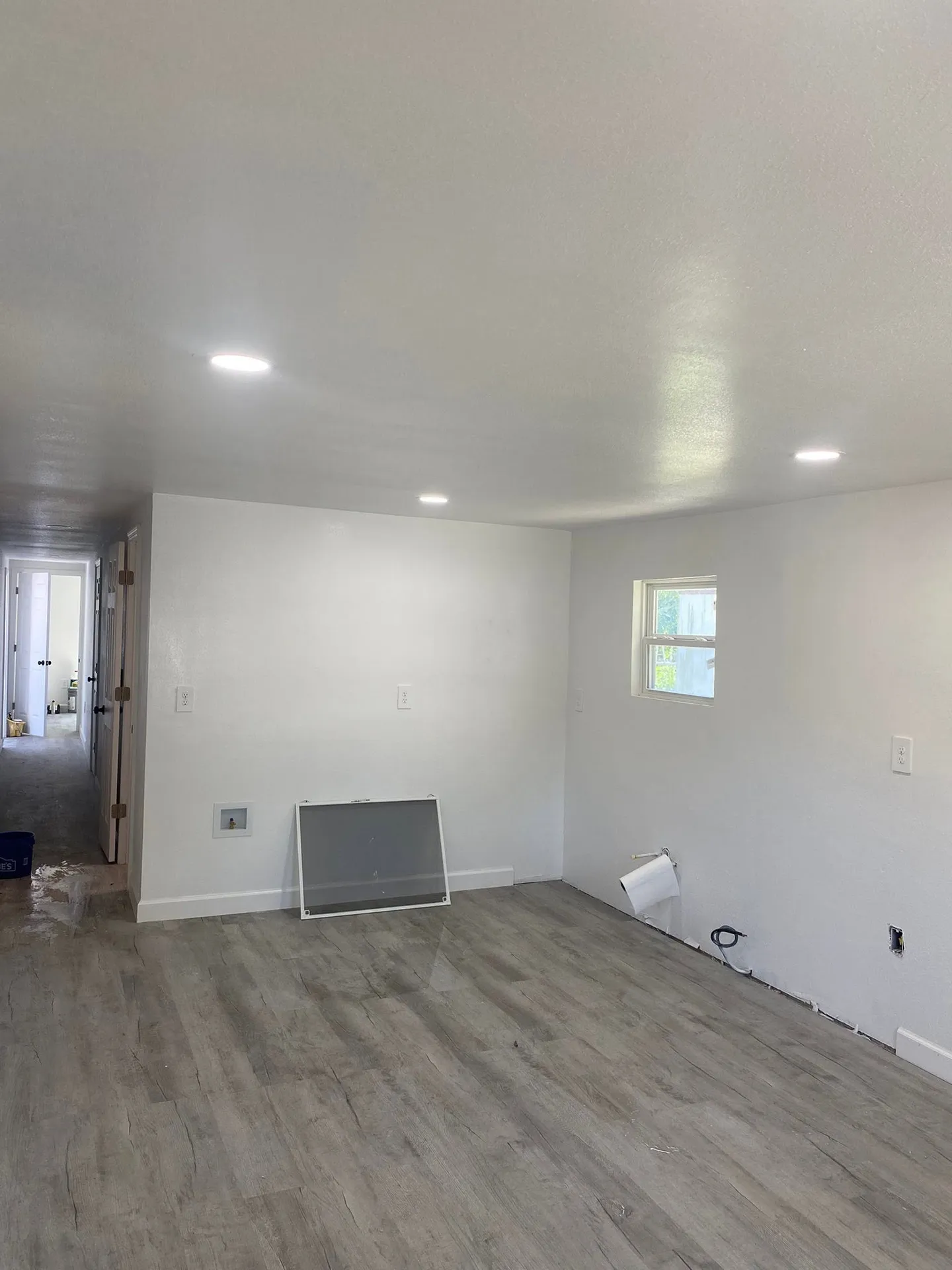 Completed interior, bathroom, door, shelving and exterior improvements.